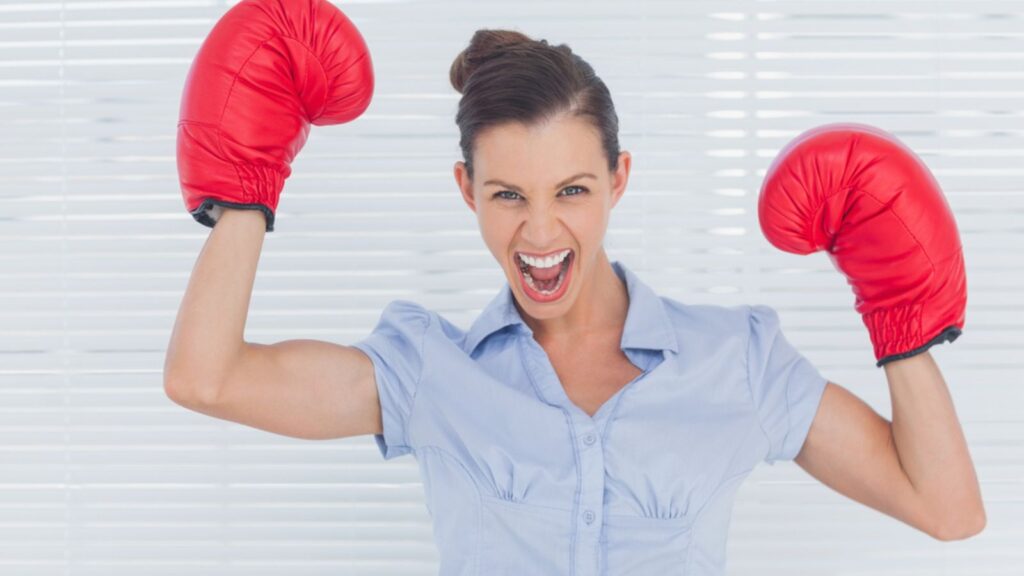 happy woman boxing with red gloves excited